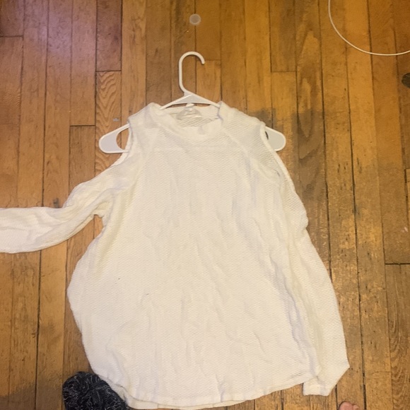 It’s a sweater with cutout shoulders by a brand named decree - Picture 2 of 2